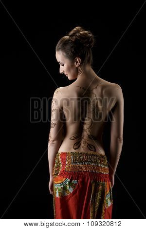 Mehndi. On woman's back henna pattern dreamcatcher