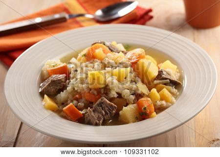 Irish coddle in a rustic bowl closeup