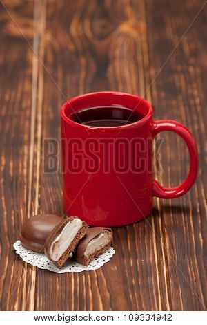 Red Mug Of Tea Or Coffee. Chocolate Marshmallows. Wooden Backgro