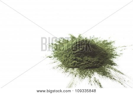 Spirulina raw powder on white background - heap.