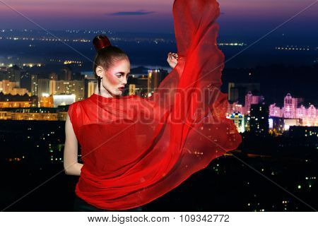 Portrait of the girl with  flyaway hair in the background of city