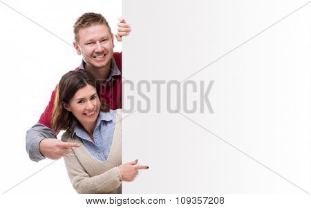 man adm woman pointing at empty blank for advertisement isolated on white background