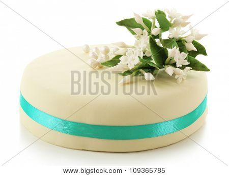 Cake with sugar paste flowers, isolated on white