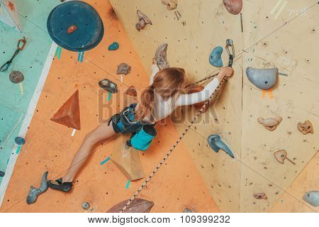 Teen Girl Climbing In Gym