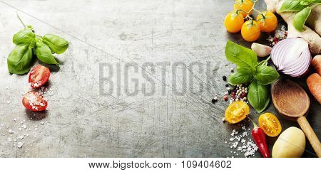 Wooden spoon and ingredients on old background. Vegetarian food, health or cooking concept.  Background layout with free text space.