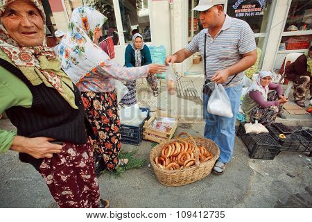 Customer Buying Traditional Bread Simit On Crowded Turkish Village Market