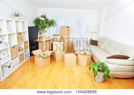 Moving boxes in new apartment. Real estate concept.