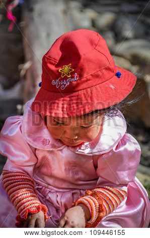 Quechua Girl Playing In A Village In The Andes, Ollantaytambo, Peru