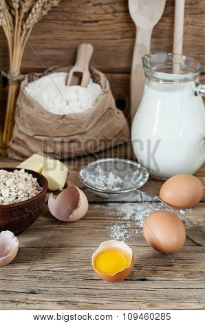Half Raw Eggs With Ingredients For Making Bakery Products