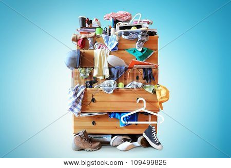 Mess, dresser with scattered clothes
