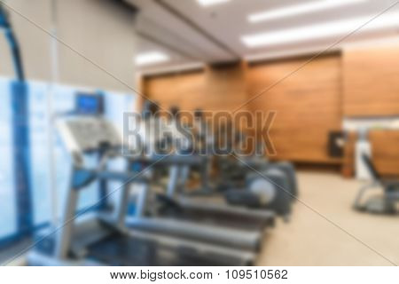 Abstract blur Fitness center with traineger equipments
