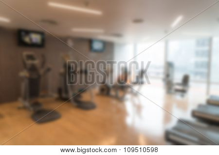 Abstract blur Fitness center with traineger equipments
