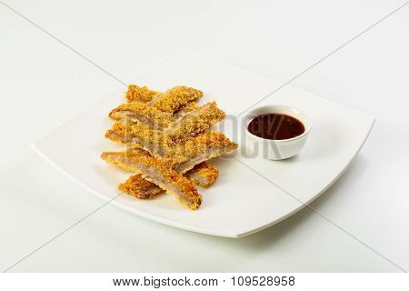 Sliced fish sticks and souce