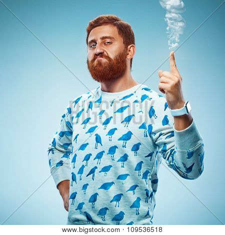 Young man pointing his finger up