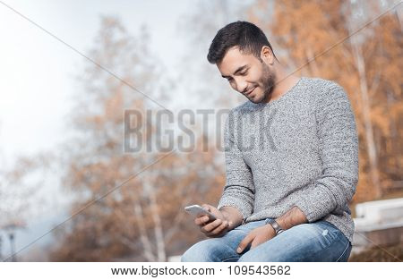 Young Man With Smartphone
