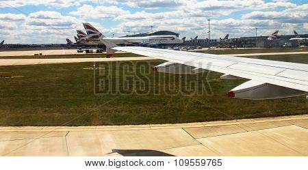 Taxiing Aircraft Airbus A-320  After Landing In Heathrow Airport . London. Uk