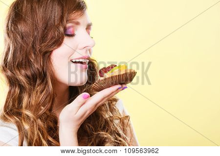 Woman Closed Eyes Holds Cake In Hand