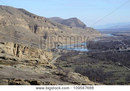 View Of High Rocky Left Bank Of The Mtkvari River From Ancient Uplistsikhe Cave Town, Georgia