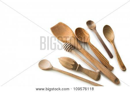 set of wooden kitchen spoons and other items on white background with textspace