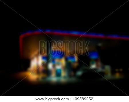Blurred / Defocussed Abstract Background Of A Gas Station At Night