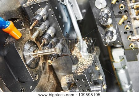 Metalworking industry. close-up view of brass detail during cutting process on moderm machining center 