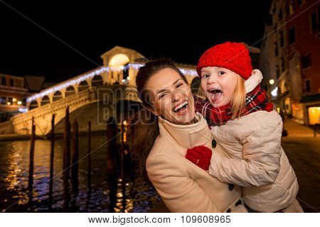 Laughing Mother And Daughter In Christmas Decorated Venice
