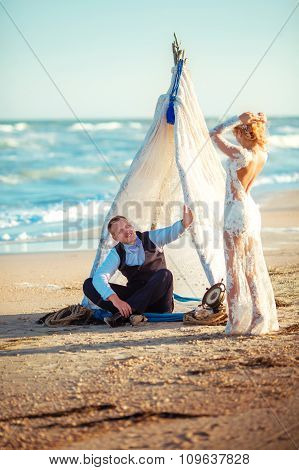 Bride and groom on their wedding day on the beach
** Note: Shallow depth of field