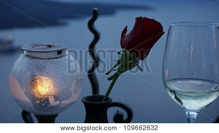 A Vine Glass And A Rose On Greece Island