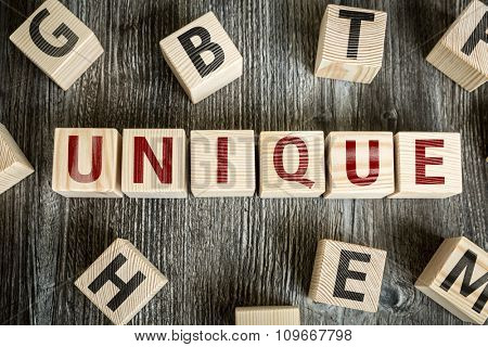 Wooden Blocks with the text: Unique