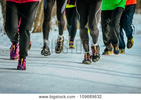 closeup of feet running athletes
