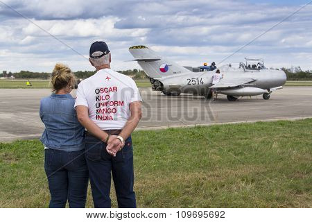 Former Owner, Collector Tom Smith Looking At Jet Fighter Aircraft Mikoyan-gurevich Mig-15 Standing O