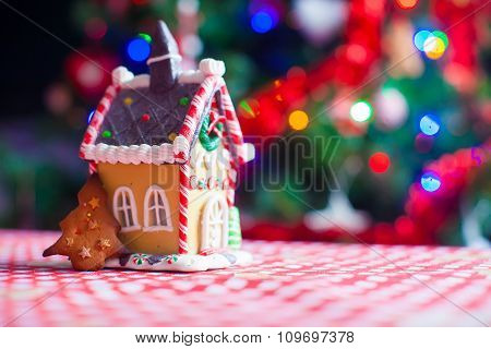 Cute gingerbread cookie and candy ginger house background Christmas tree lights