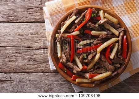 Peruvian Cuisine: Lomo Saltado On A Plate. Horizontal Top View
