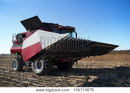 Combine Harvester Working On The Field