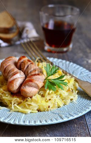 Sour Cabbage Stew With Grilled Sausage.