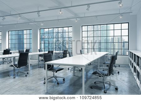 Workplaces In A Bright Modern Loft Open Space Office. Empty Tables And Docents' Book Shelves. Singap