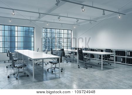Workplaces In A Bright Modern Loft Open Space Office. Empty Tables And Docents' Book Shelves. Singap