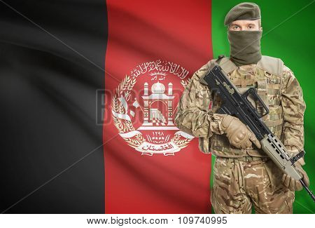 Soldier Holding Machine Gun With Flag On Background Series - Afghanistan