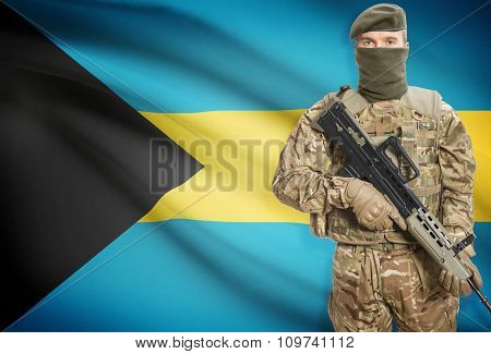 Soldier Holding Machine Gun With Flag On Background Series - Bahamas