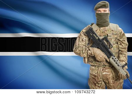 Soldier Holding Machine Gun With Flag On Background Series - Botswana