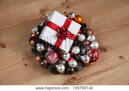 New Year gift on a golden tinsel background boly