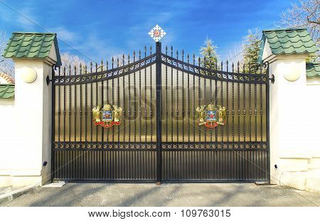 Metal door with Coat of Arms of Romanian Orthodox Church on March 13, 2015 in Bucharest, Romania