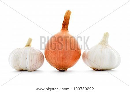 Whole fresh gold onion, two garlic bulbs isolated on white