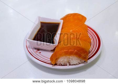 Salmon sushi set with shoyu sauce on isolated background