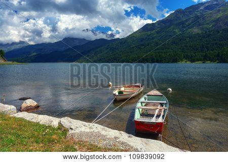 Amazing sunny day at Champferersee lake in the Swiss Alps. Silvaplana village, Switzerland, Europe.