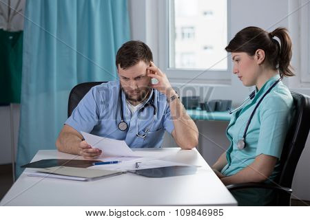 Doctor Analsying Patient Health Record