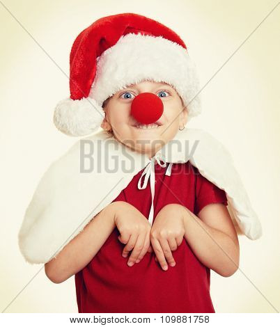 girl in santa hat with clown nose, yellow toned