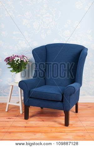 Blue arm chair in vintage interior