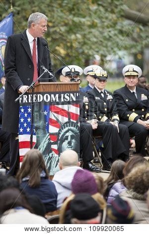 NEW YORK - NOVEMBER 11 2015: New York City Mayor Bill De Blasio speaks to the audience at the opening ceremony in Madison Square Park before the annual Americas Parade up 5th Avenue on Veterans Day.