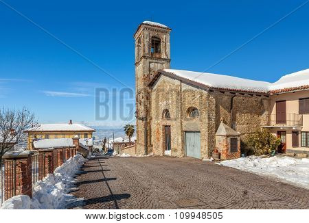 Old brick church in small town of Montelupo Albese in Piedmont, Northern Italy.